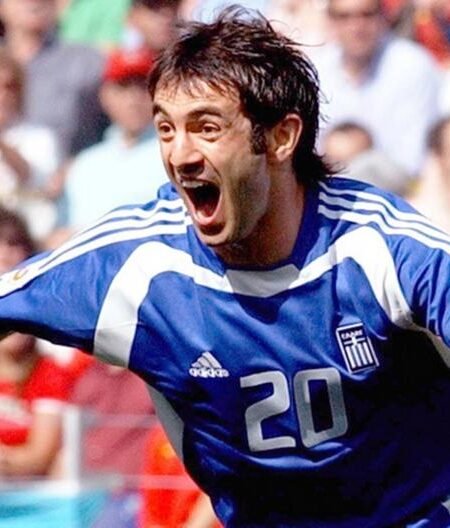 COLLECTABLE REPLICA SHIRT OF EURO 2004 SIGNED BY THE CAPTAIN AND EUROPEAN CHAMPION GIORGO KARAGKOUNI