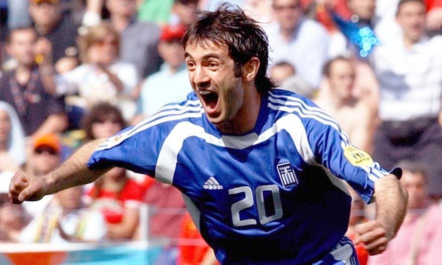 COLLECTABLE REPLICA SHIRT OF EURO 2004 SIGNED BY THE CAPTAIN AND EUROPEAN CHAMPION GIORGO KARAGKOUNI