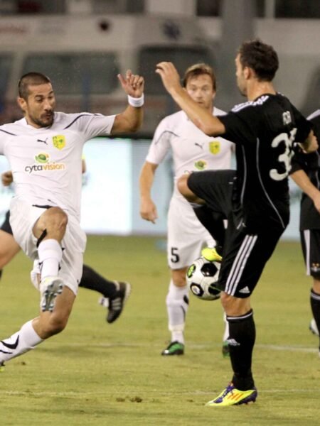 GIANNIS SKOPELITIS - AEK LARNACA - MATCH WORN AND TEAM SIGNED JERSEY - AEK VS ROSENBORG (2-1, 25/08/2011) - SEASON 2011/2012